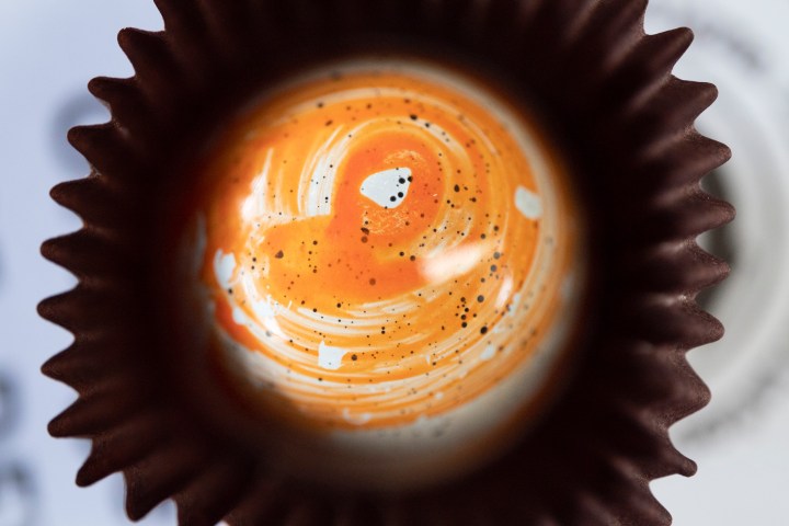 Top view of a marbled chocolate in a dark wrapper.