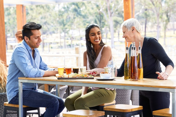 a group of people sitting at a table