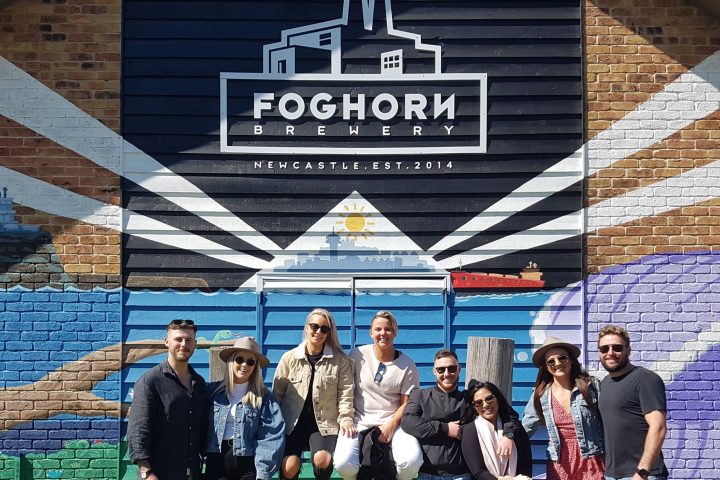 a group of people standing in front of a building