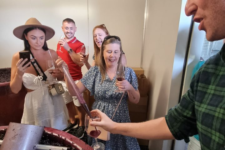 a group of people standing next to a knife