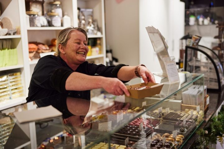 a person cooking in a kitchen preparing food