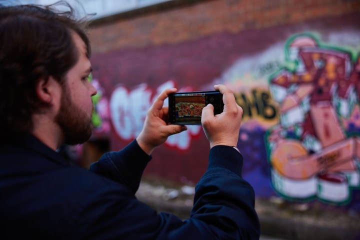 a man holding a phone