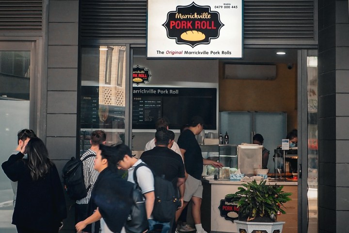 a group of people standing in front of a building