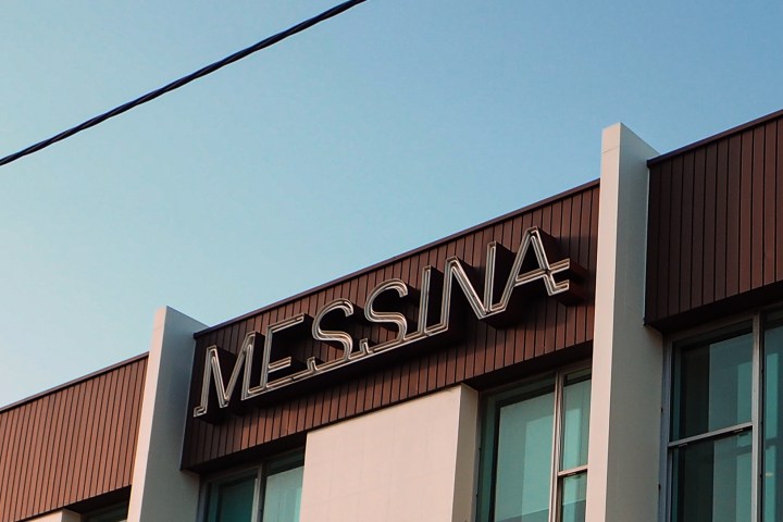 a sign in front of a building