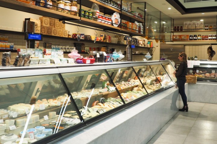 a person standing in front of a store