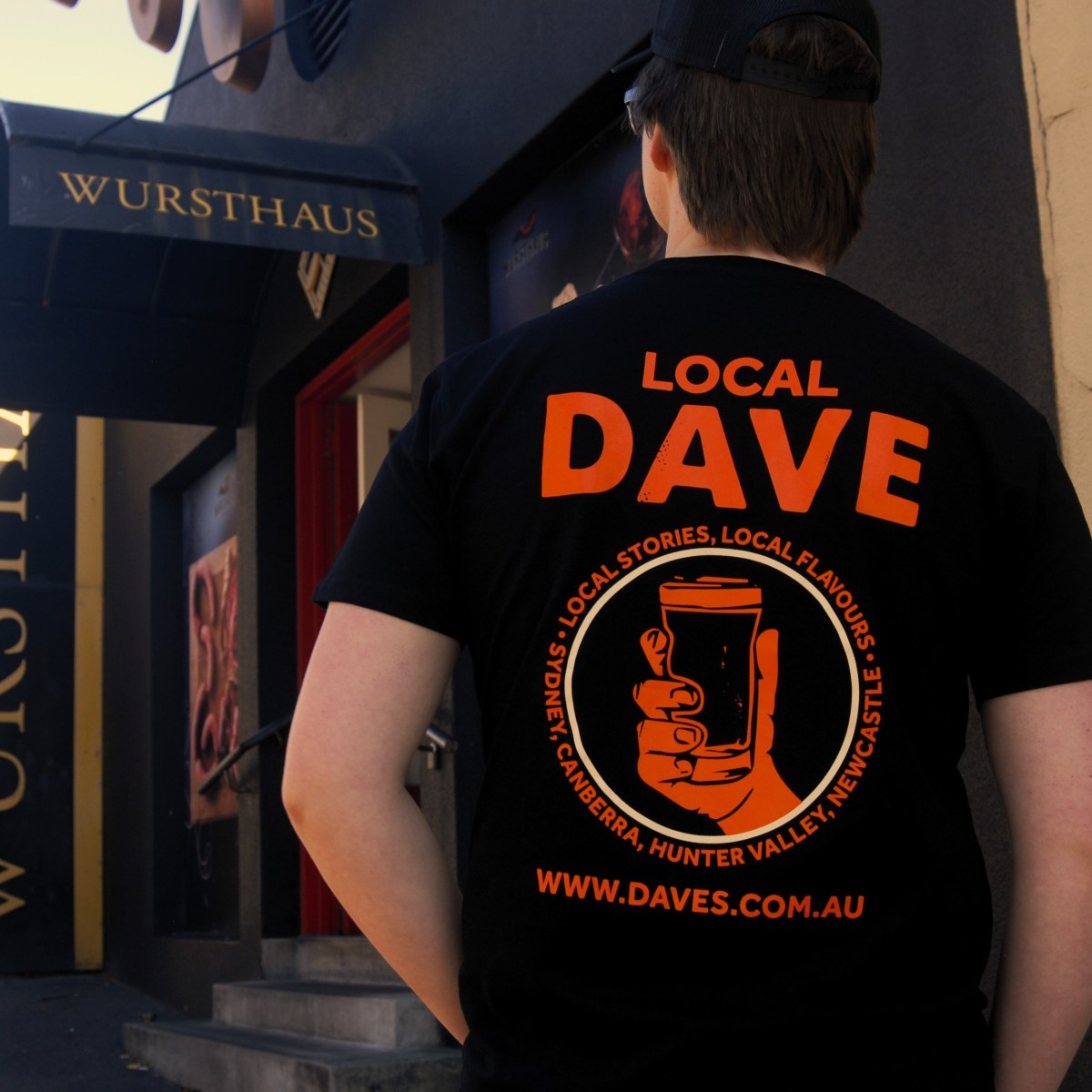 a person standing in front of a store