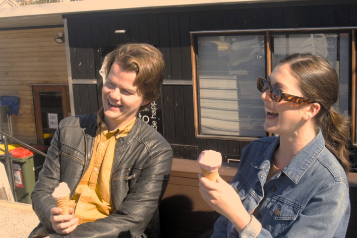 a group of people holding wine glasses