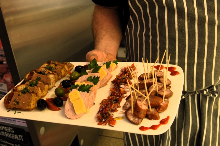 a person cutting food on a plate
