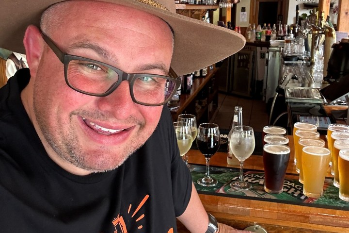 a man wearing a hat and glasses