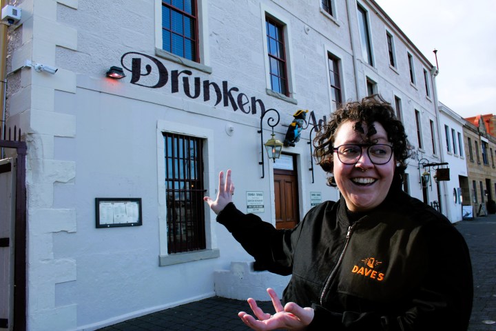 a man standing in front of a building