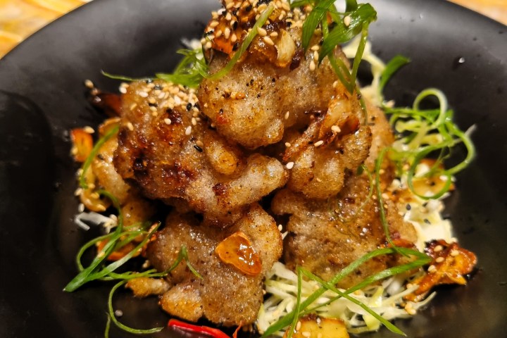 a bowl filled with meat and vegetables